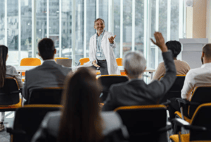 A group of healthcare professionals at a medical symposium.