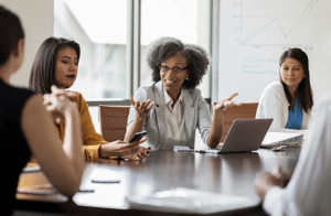 Members of an advisory board discuss options with the hiring team.